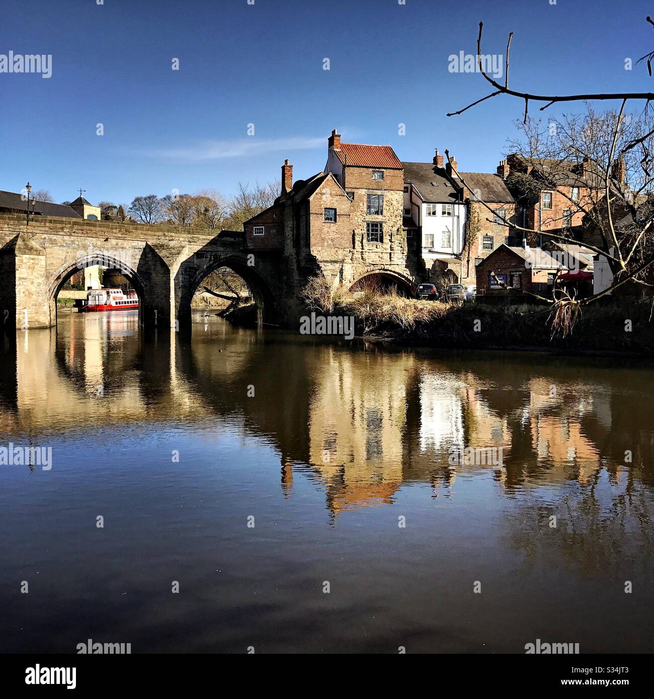 Architecture of Durham City, North East England. Scenic view of Elvet Bridge over the River Wear. Medieval masonry arch bridge. - Smartphone Captured Stock Image