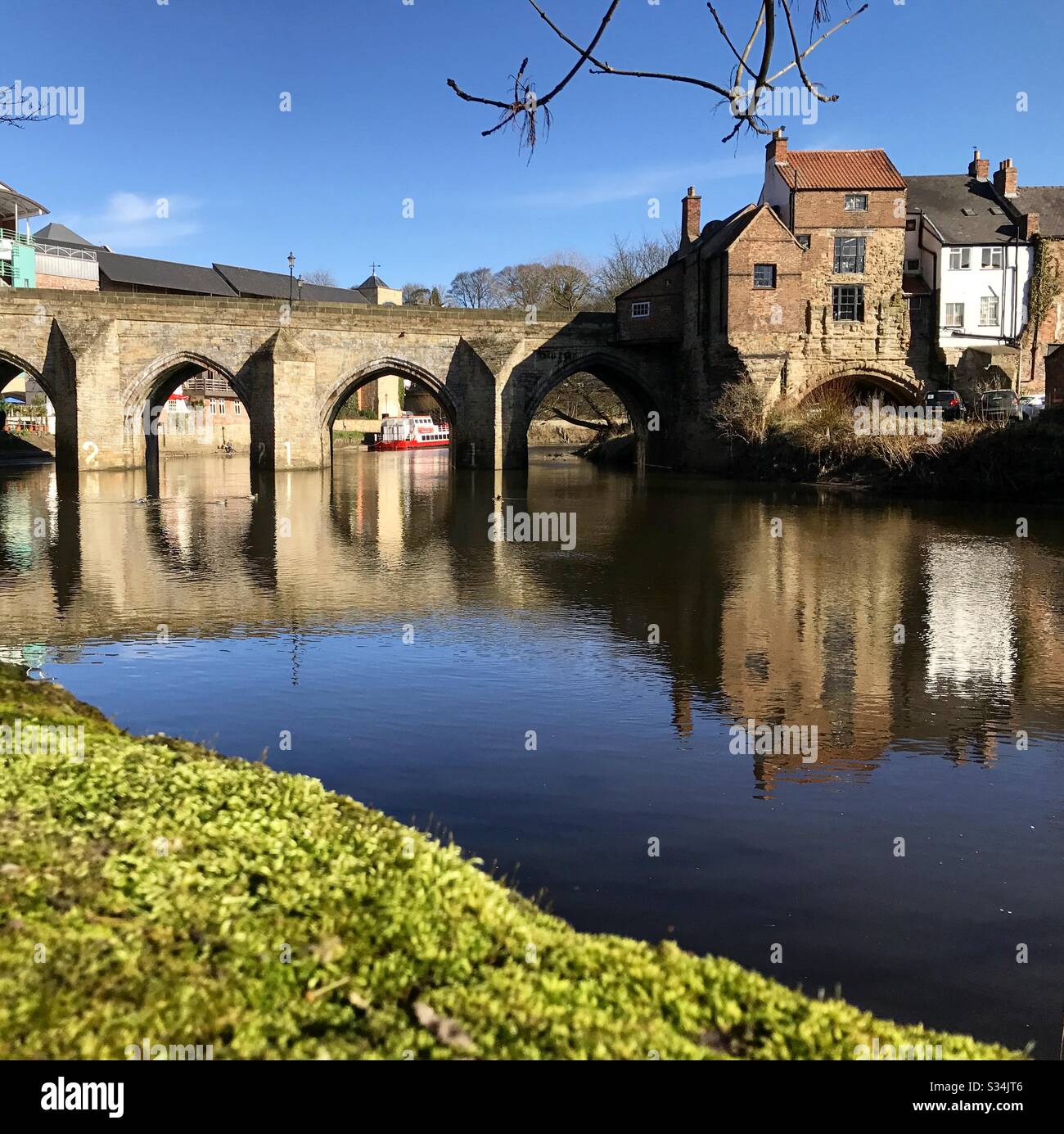 Architecture of Durham City, North East England. Scenic view of Elvet Bridge over the River Wear. Medieval masonry arch bridge. - Smartphone Captured Stock Image