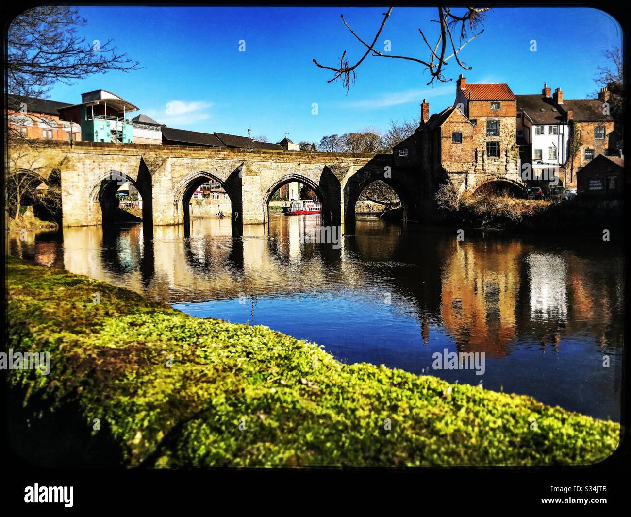 Architecture of Durham City, North East England. Scenic view of Elvet Bridge over the River Wear. Medieval masonry arch bridge. - Smartphone Captured Stock Image