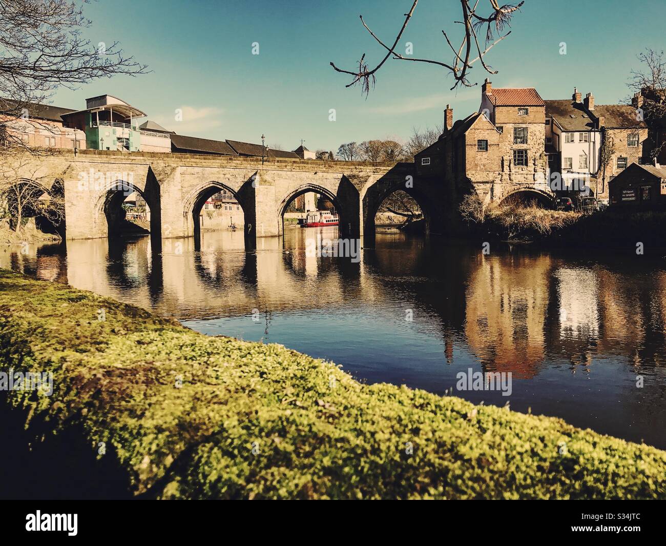 Architecture of Durham City, North East England. Scenic view of Elvet Bridge over the River Wear. Medieval masonry arch bridge. - Smartphone Captured Stock Image