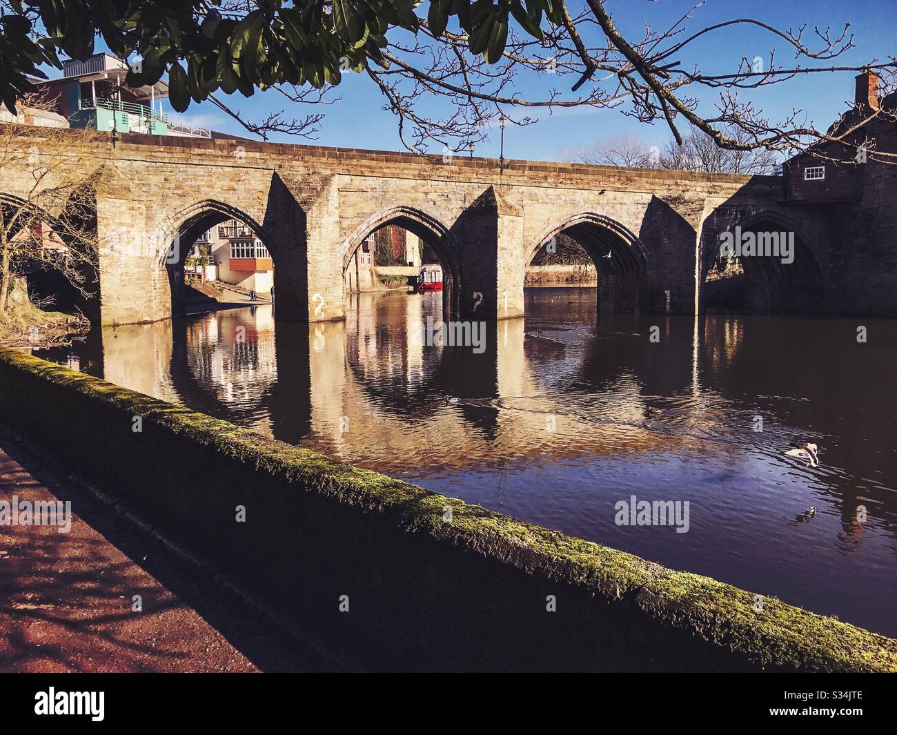 Architecture of Durham City, North East England. Scenic view of Elvet Bridge over the River Wear. Medieval masonry arch bridge. - Smartphone Captured Stock Image