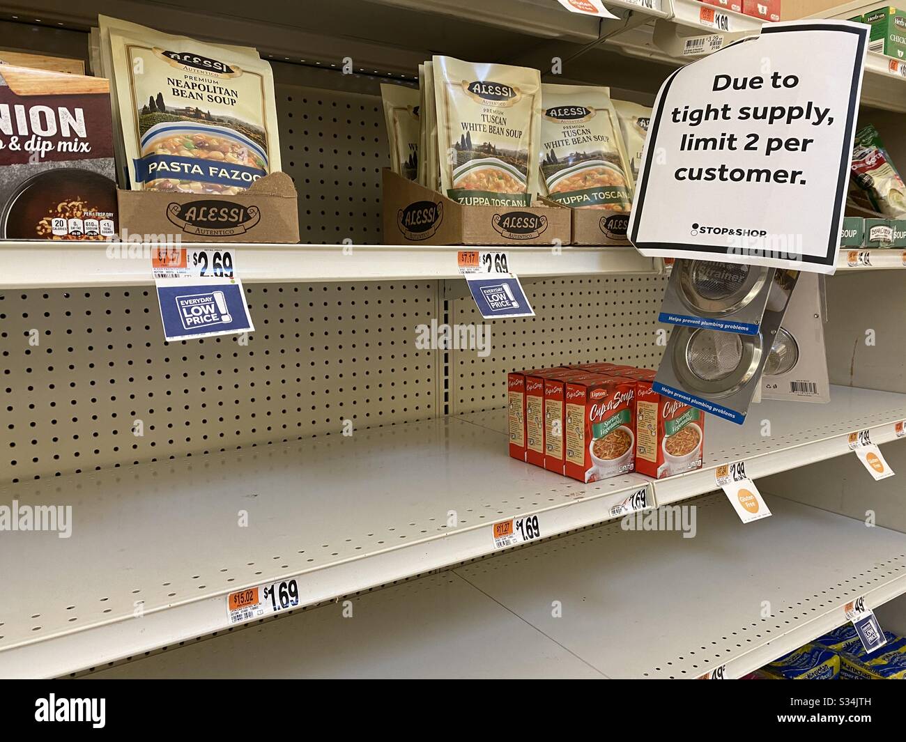 Stores limit customers to two items due to shortages as a result of panic buying caused by covid-19 virus. - Smartphone Captured Stock Image