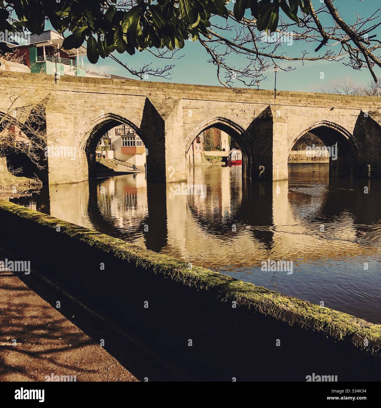 Architecture of Durham City, North East England. Scenic view of Elvet Bridge over the River Wear. Medieval masonry arch bridge. - Smartphone Captured Stock Image