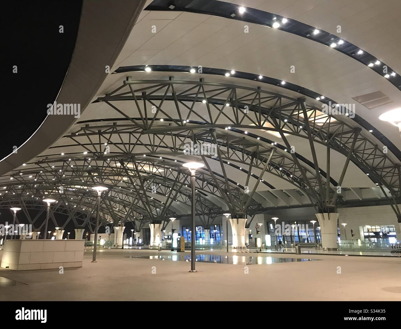 Empty Airport: the Muscat international airport ,Oman, with hardly a sole around closed its gates on 29th March as the Country went into lockdown from foreign travelers - Smartphone Captured Stock Image