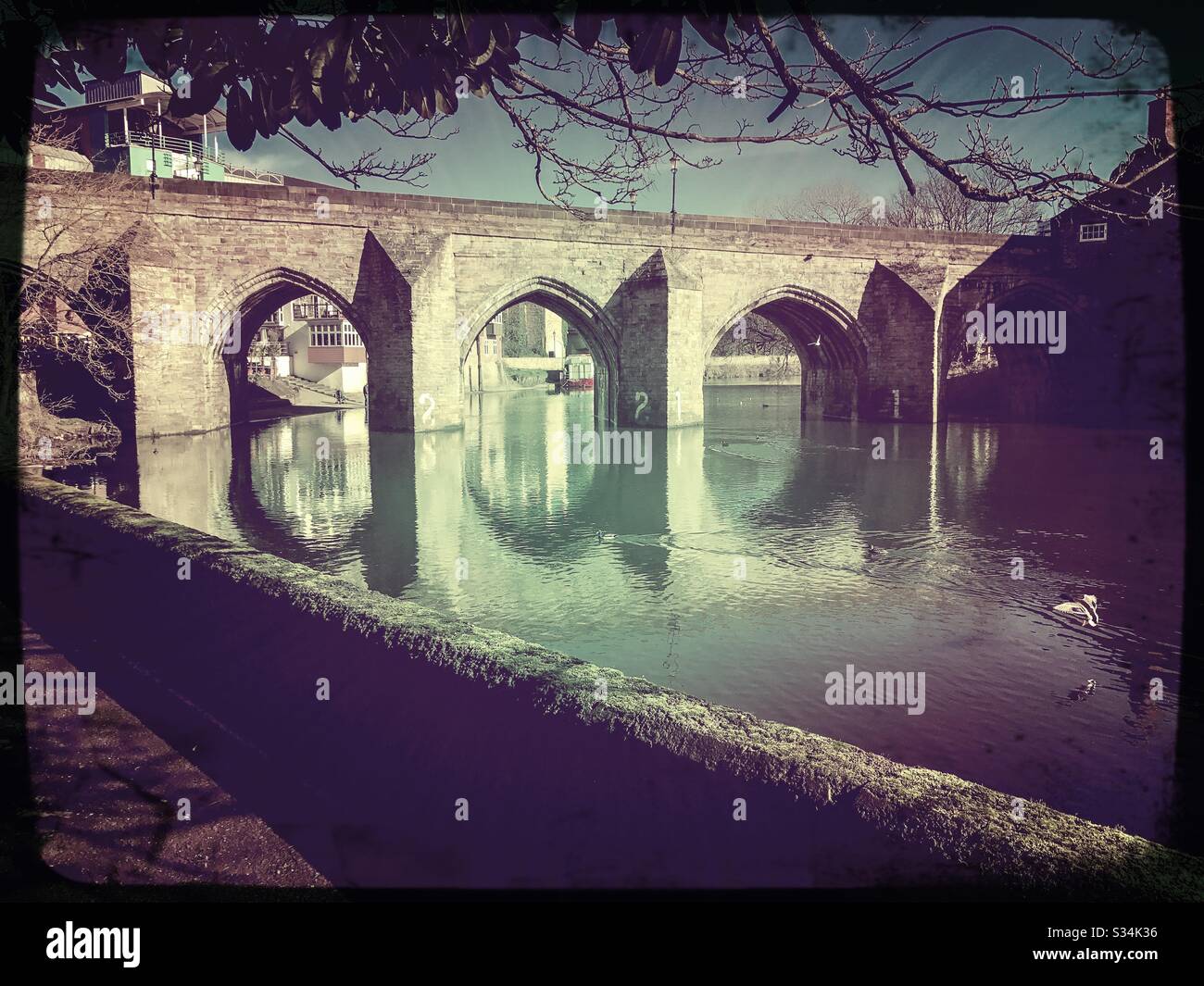 Architecture of Durham City, North East England. Scenic view of Elvet Bridge over the River Wear. Medieval masonry arch bridge. - Smartphone Captured Stock Image