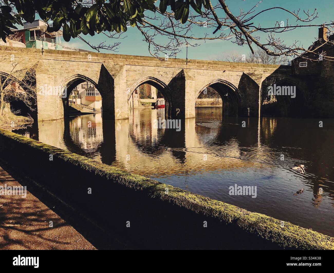 Architecture of Durham City, North East England. Scenic view of Elvet Bridge over the River Wear. Medieval masonry arch bridge. - Smartphone Captured Stock Image