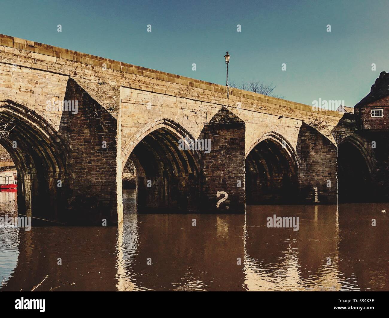 Architecture of Durham City, North East England. Scenic view of Elvet Bridge over the River Wear. Medieval masonry arch bridge. - Smartphone Captured Stock Image