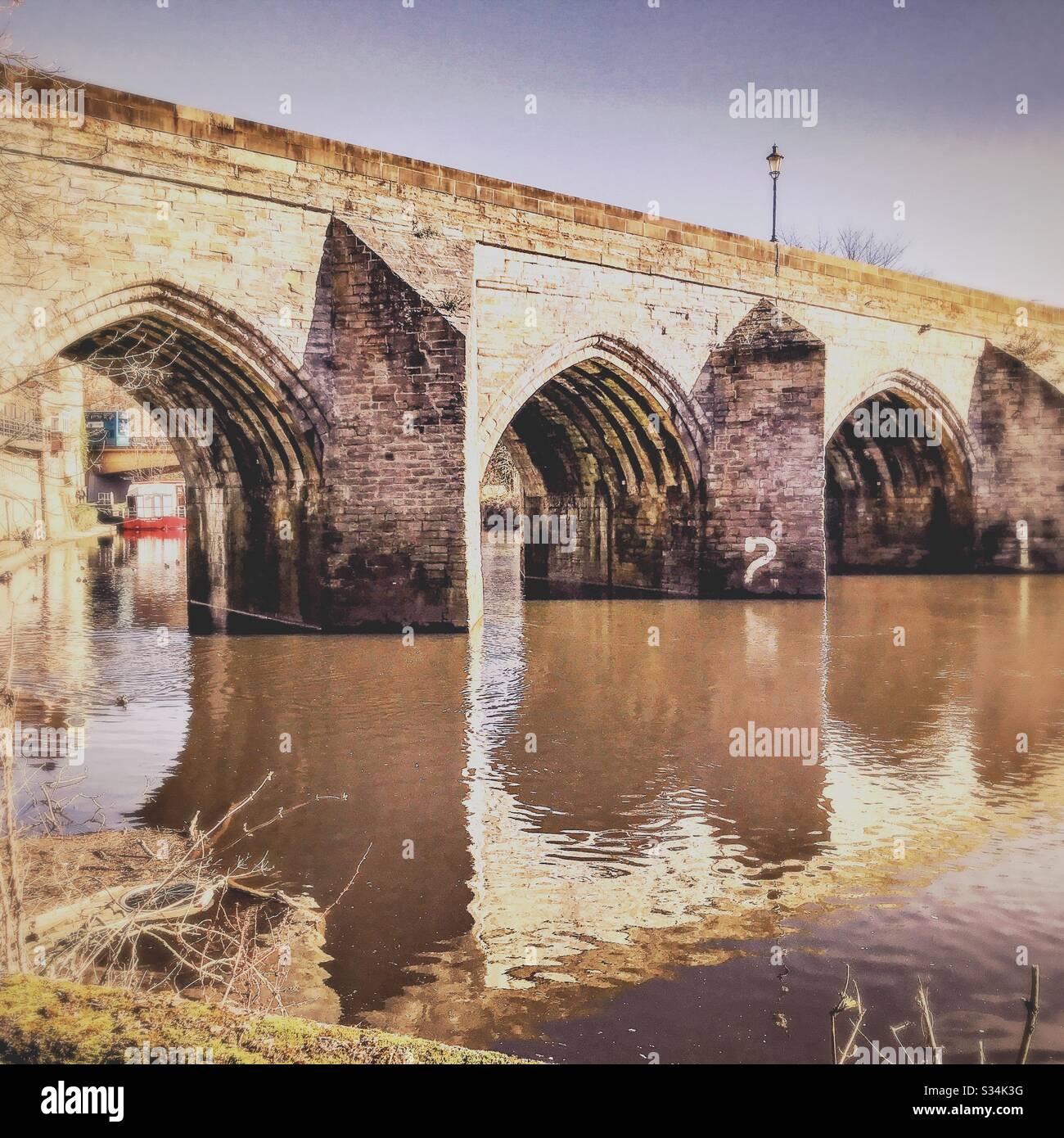 Architecture of Durham City, North East England. Scenic view of Elvet Bridge over the River Wear. Medieval masonry arch bridge. - Smartphone Captured Stock Image