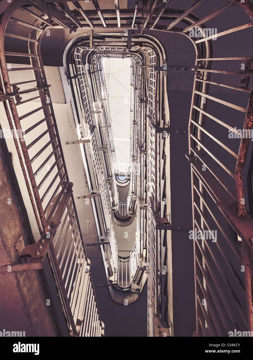 Looking straight up the rectangular spiral staircase of Prince