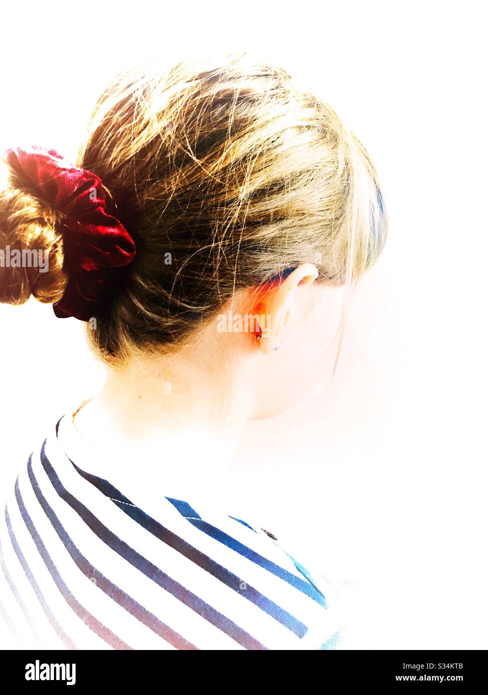 Rear view of girl with hair up Stock Photo