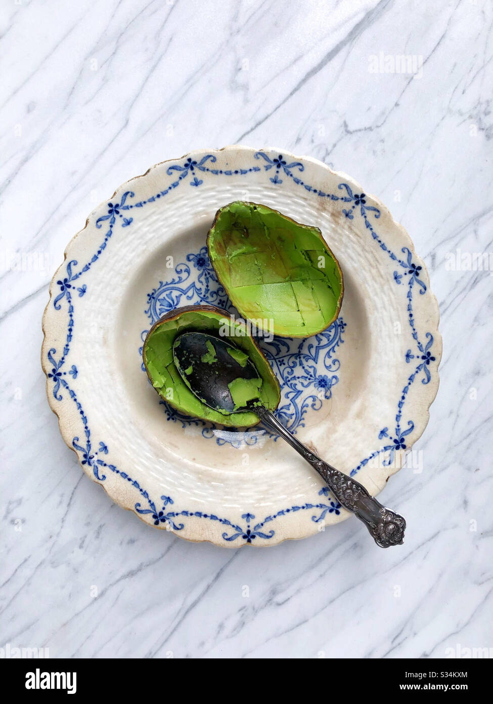 Remains of avocado, shells / skins after eating the last ripe avocado - Smartphone Captured Stock Image