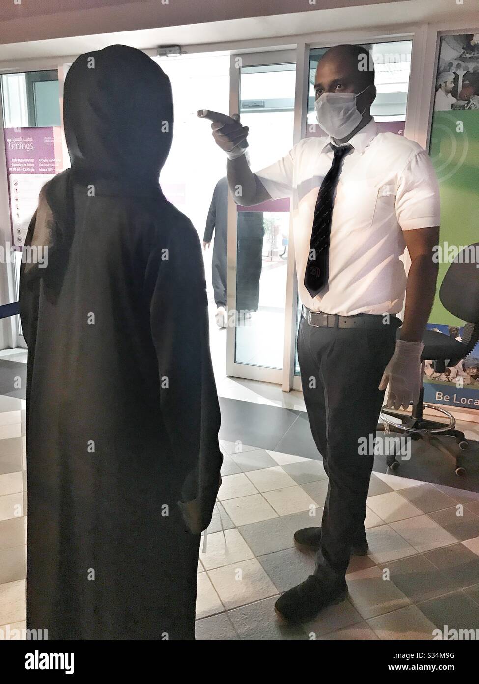 Checking customers temperature before entering supermarket: to reduce the spread of Corona virus major supermarkets check customers’ temperature at the entrance - Smartphone Captured Stock Image