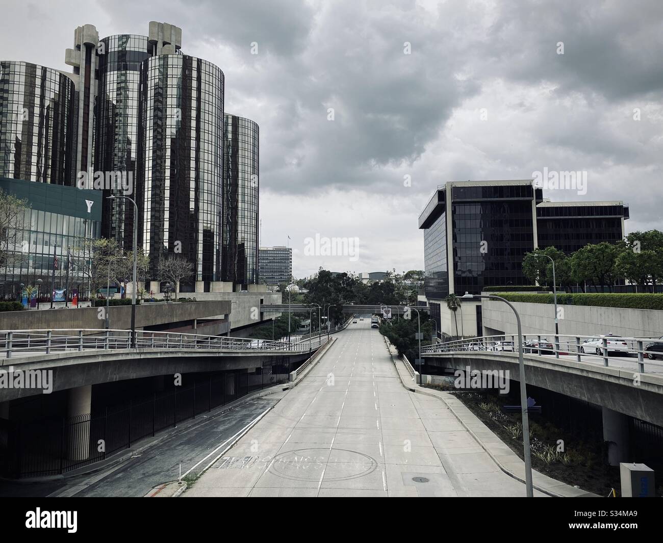 LOS ANGELES, CA, MAR 2020: looking west on empty 4th Street during coronavirus "stay at home" orders. Downtown YMCA and Westin Bonaventure hotel on left. - Smartphone Captured Stock Image