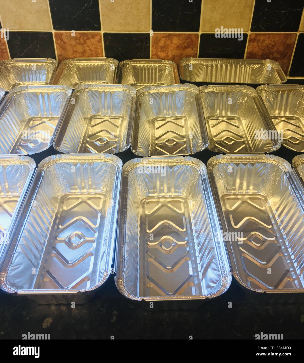 Foil containers ready for food to be stored - stockpiling food for delivery Stock Photo