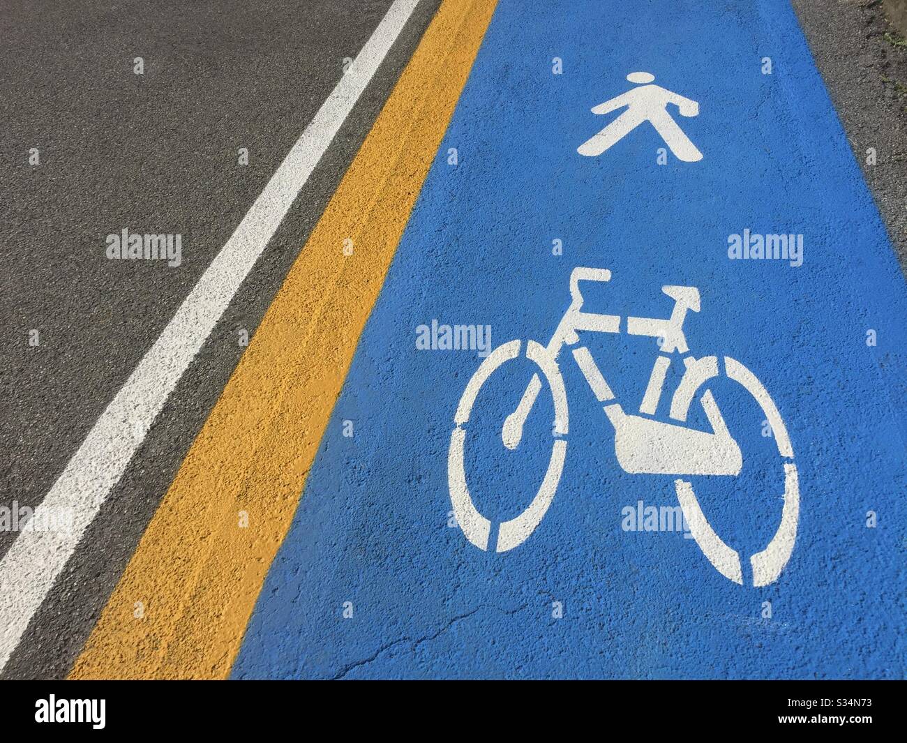 Italy, Lombardy, Bicycle Road Sign on Asphalt - Smartphone Captured Stock Image