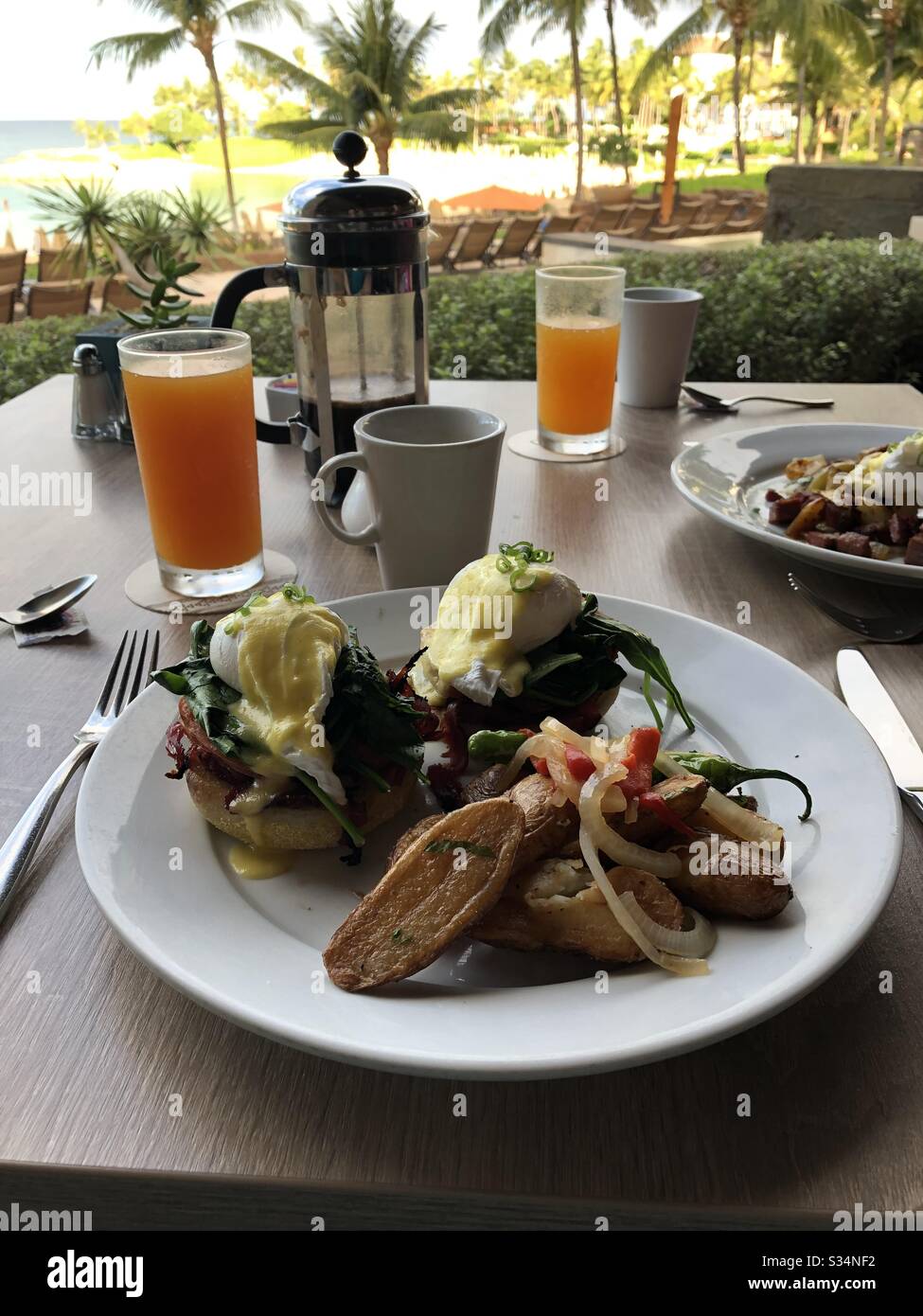 Eggs benedict by the beach Stock Photo Alamy