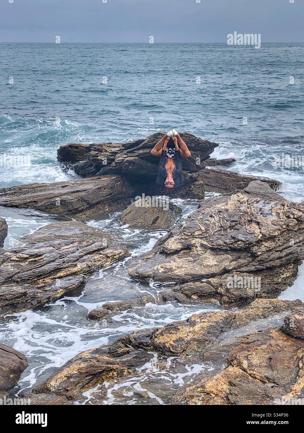 Acrobats on the rocks. - Smartphone Captured Stock Image
