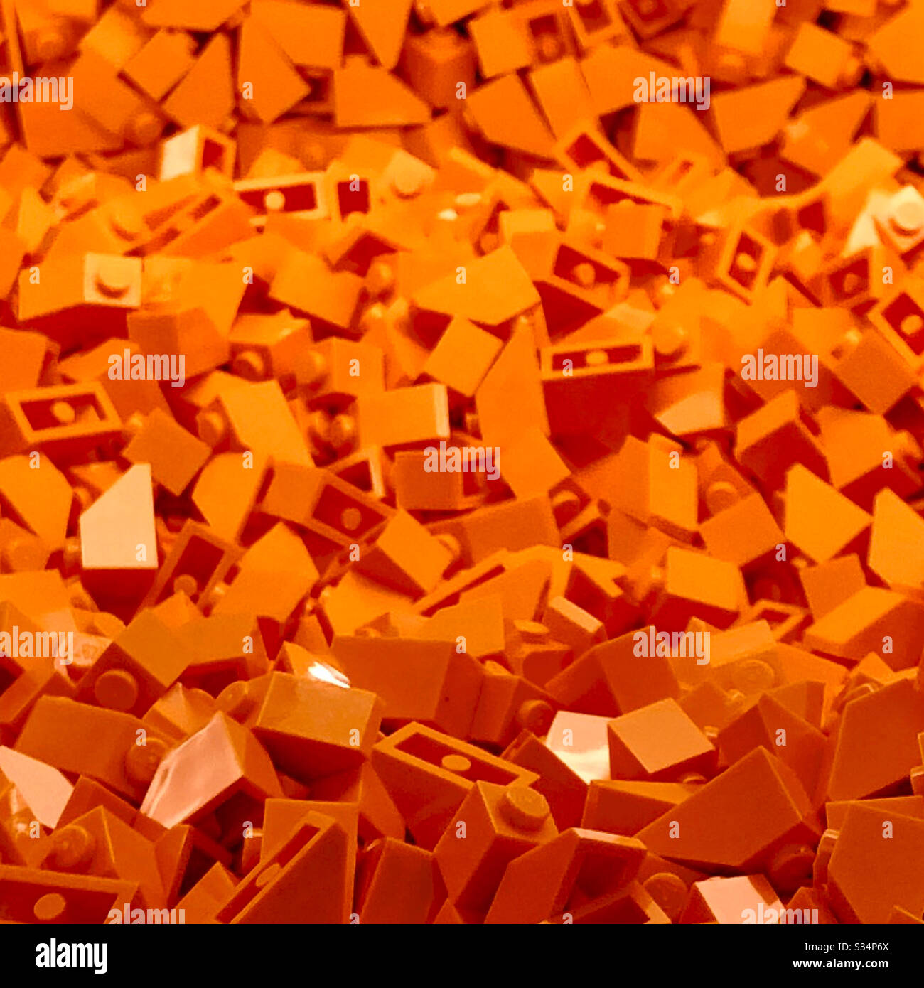 Orange interlocking toy bricks Stock Photo