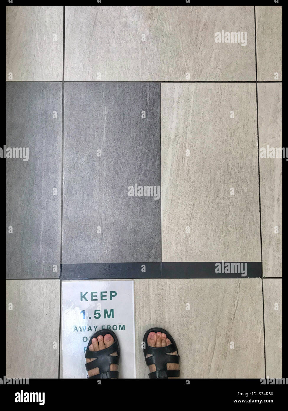 Queueing at safe distance during coronavirus pandemic 2020, Cape Town, South Africa. - Smartphone Captured Stock Image