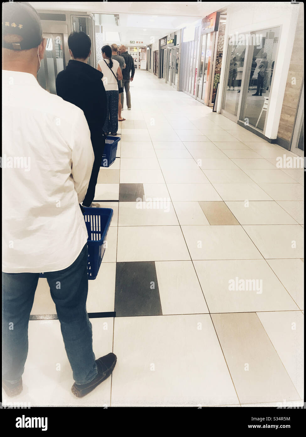 Marked lines for queuing at shops during coronavirus pandemic to ensure social distancing, Cape Town, South Africa. - Smartphone Captured Stock Image