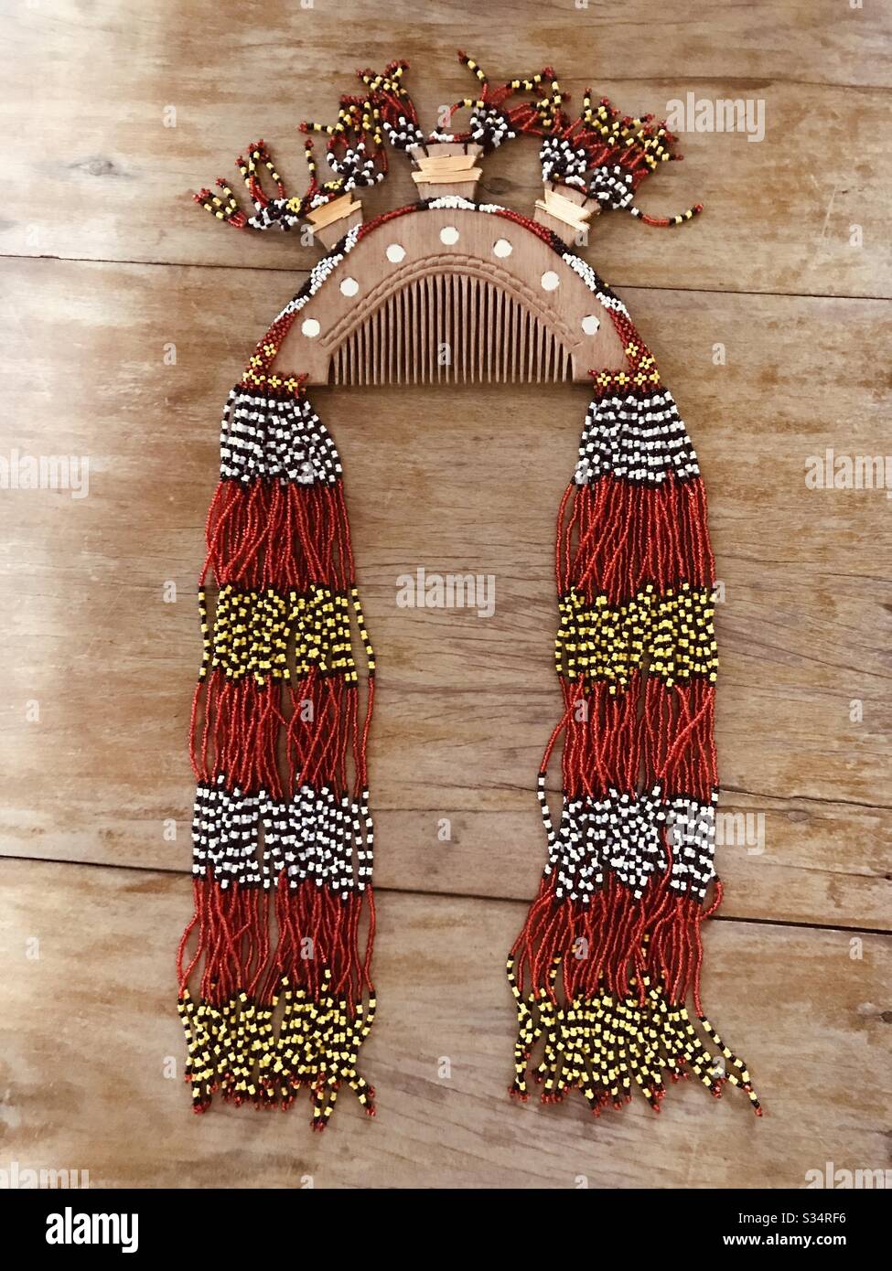 An intricate headdress of a T’boli princess, an ethnic group from the Philippines. An elaborate art of carved wood comb, glass to bounce off bad spirits, and colorful beads manually stringed together. Stock Photo