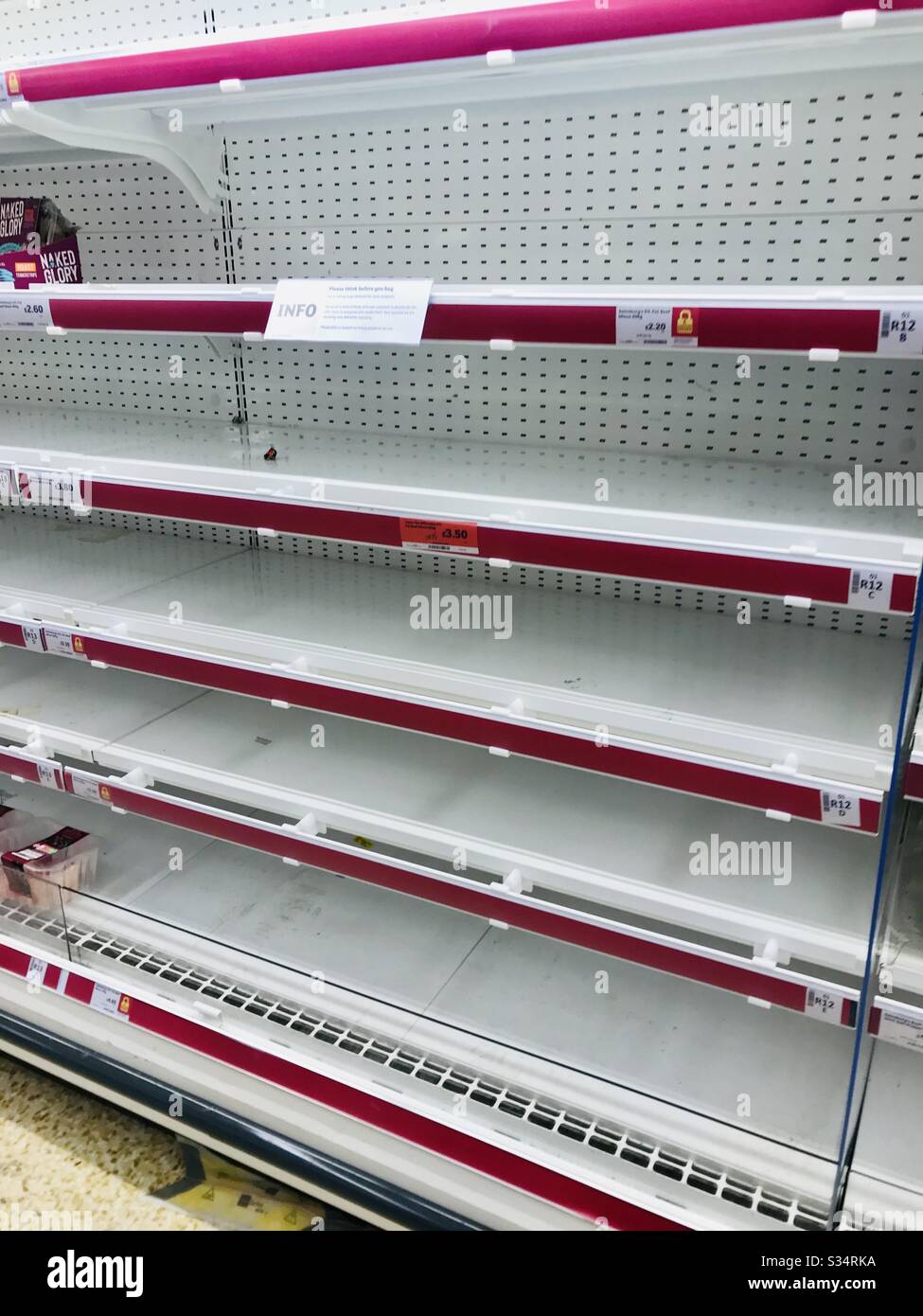 Empty supermarket shelves Stock Photo