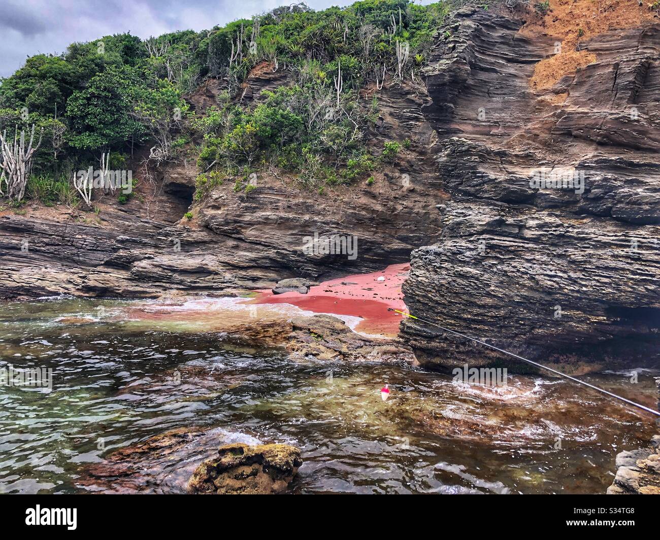 A tiny pink beach in Buzios, Brazil. Stock Photo