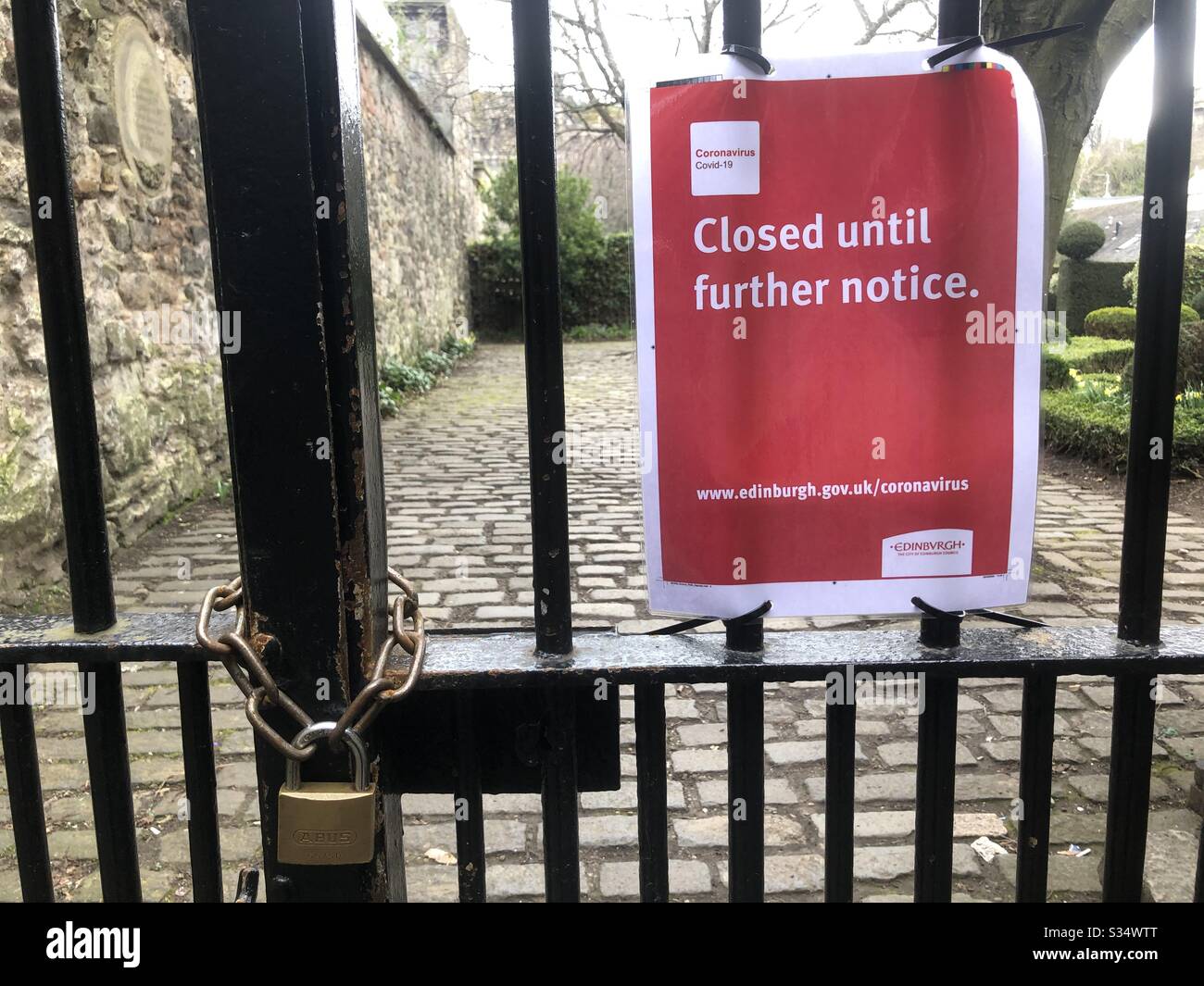 Locked gate to public park in Edinburgh Scotland during Coronavirus lockdown Stock Photo