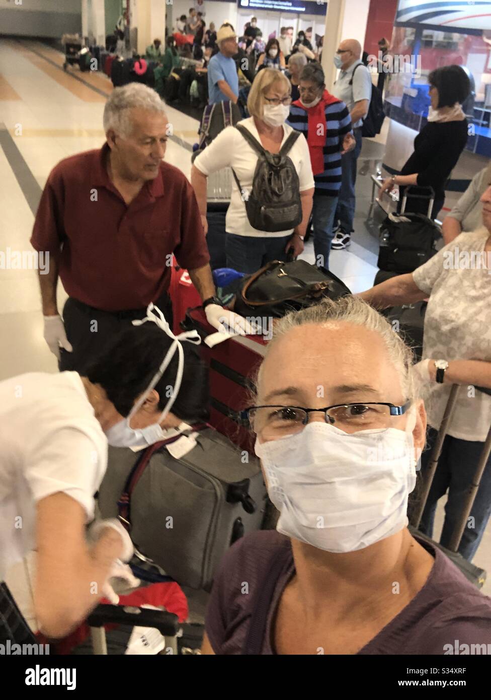 Check-in lineup during the pandemic of 2020. - Smartphone Captured Stock Image