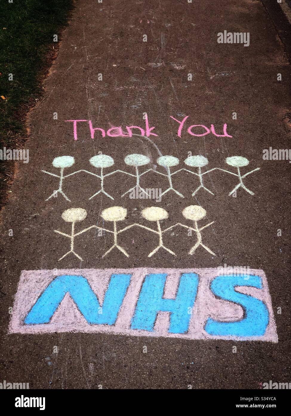 'Thank you NHS' public support message chalked on pavement sidewalk during coronavirus outbreak 2020 Stock Photo
