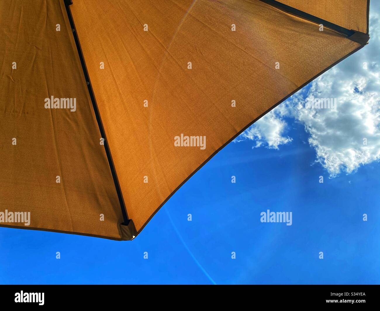 Sun umbrella and sky Stock Photo Alamy