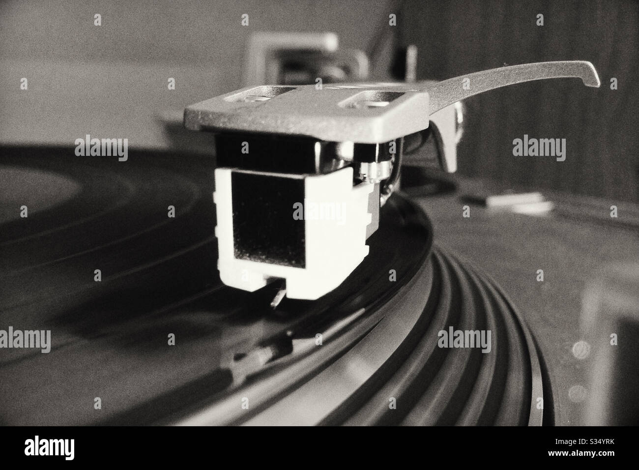 Close Up of Turntable Stylus Playing Record Stock Photo