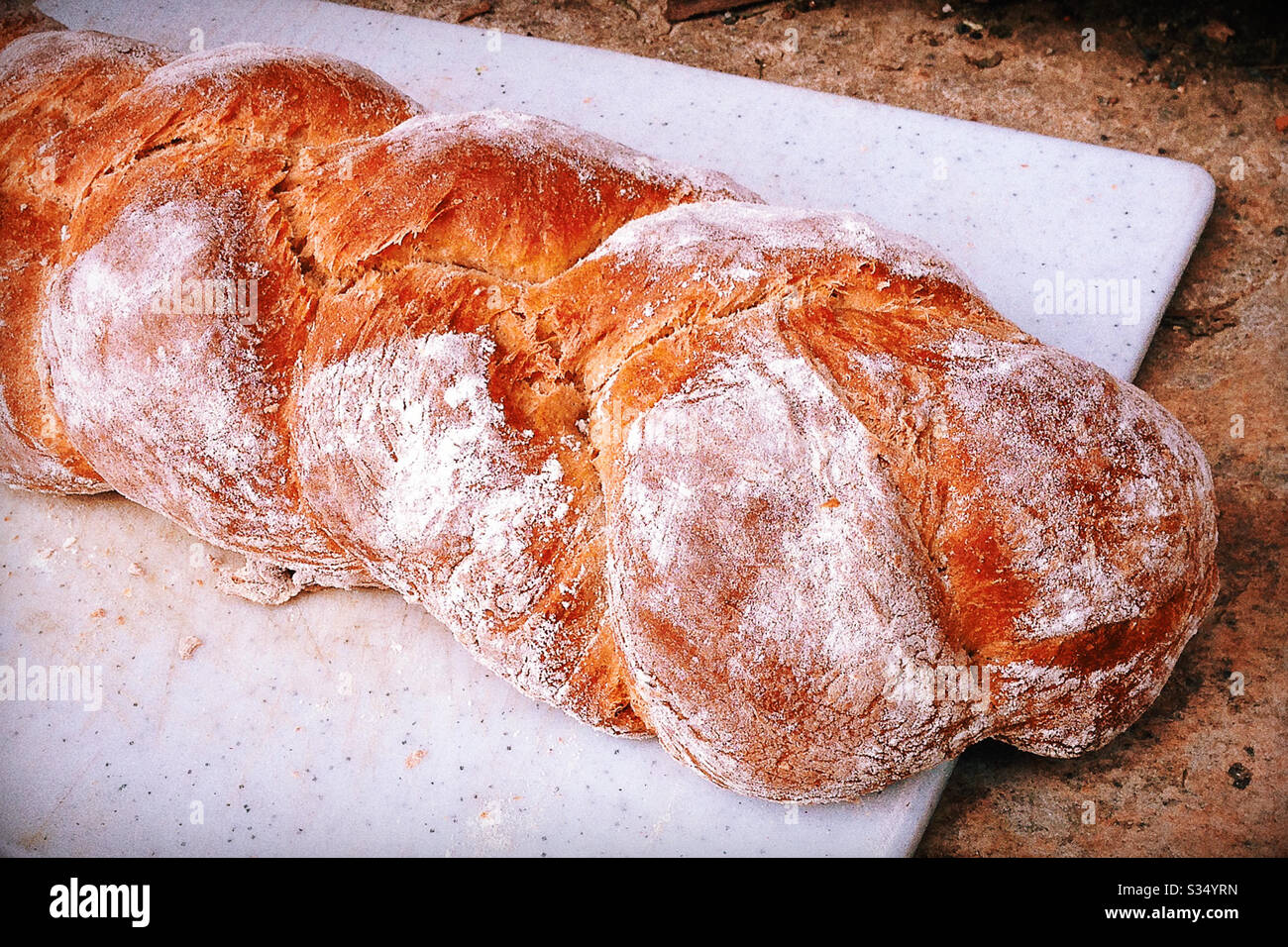 Close Up of Challah Bread on Cutting Board Stock Photo