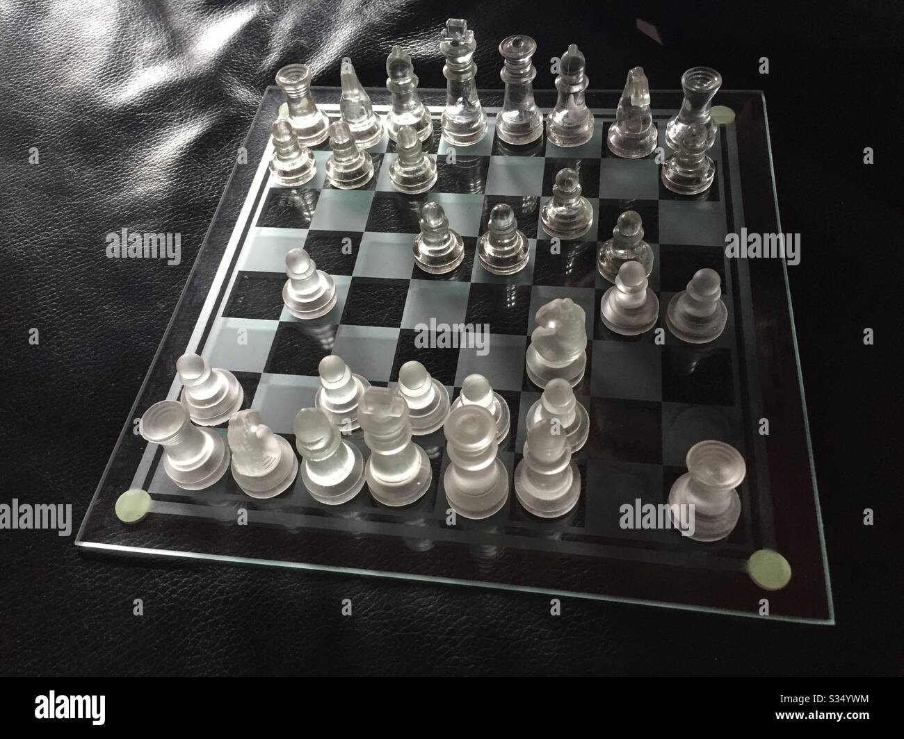 Playing chess to pass the time while under stay at home orders in Galveston, TX. - Smartphone Captured Stock Image