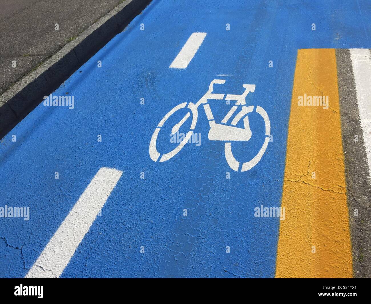 Italy, Lombardy, Bicycle Road Sign on Asphalt - Smartphone Captured Stock Image