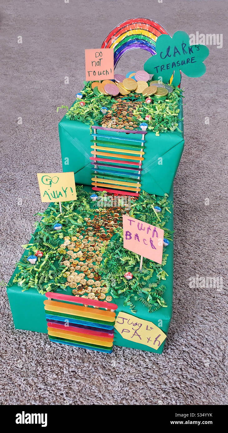Colorful DIY Leprechaun Trap made by a child and Mom for a school project with, rainbow, ladder, path, signs, path and gold coins. - Smartphone Captured Stock Image