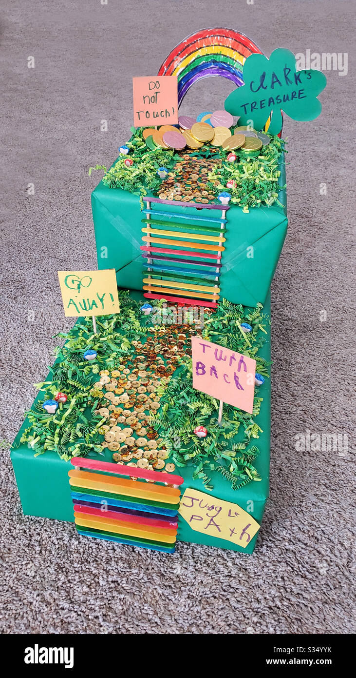 Colorful DIY Leprechaun Trap made by a child and Mom for a school project with, rainbow, ladder, path, signs, path and gold coins. Stock Photo