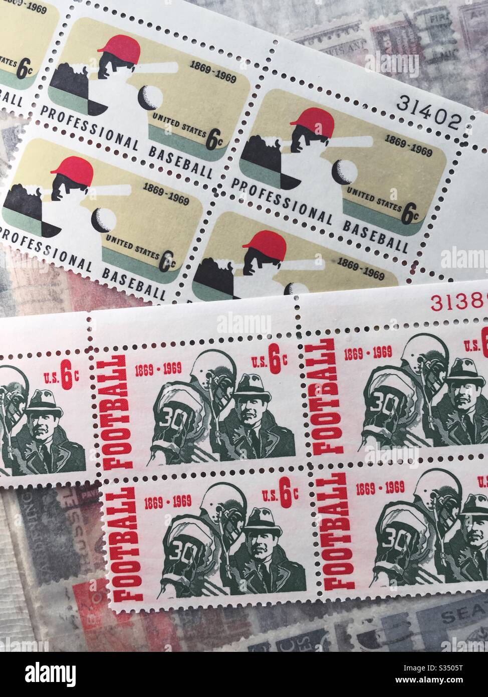 Vintage professional baseball and professional football commemorative stamps as part of a stamp collection from the 1960s, USA - Smartphone Captured Stock Image
