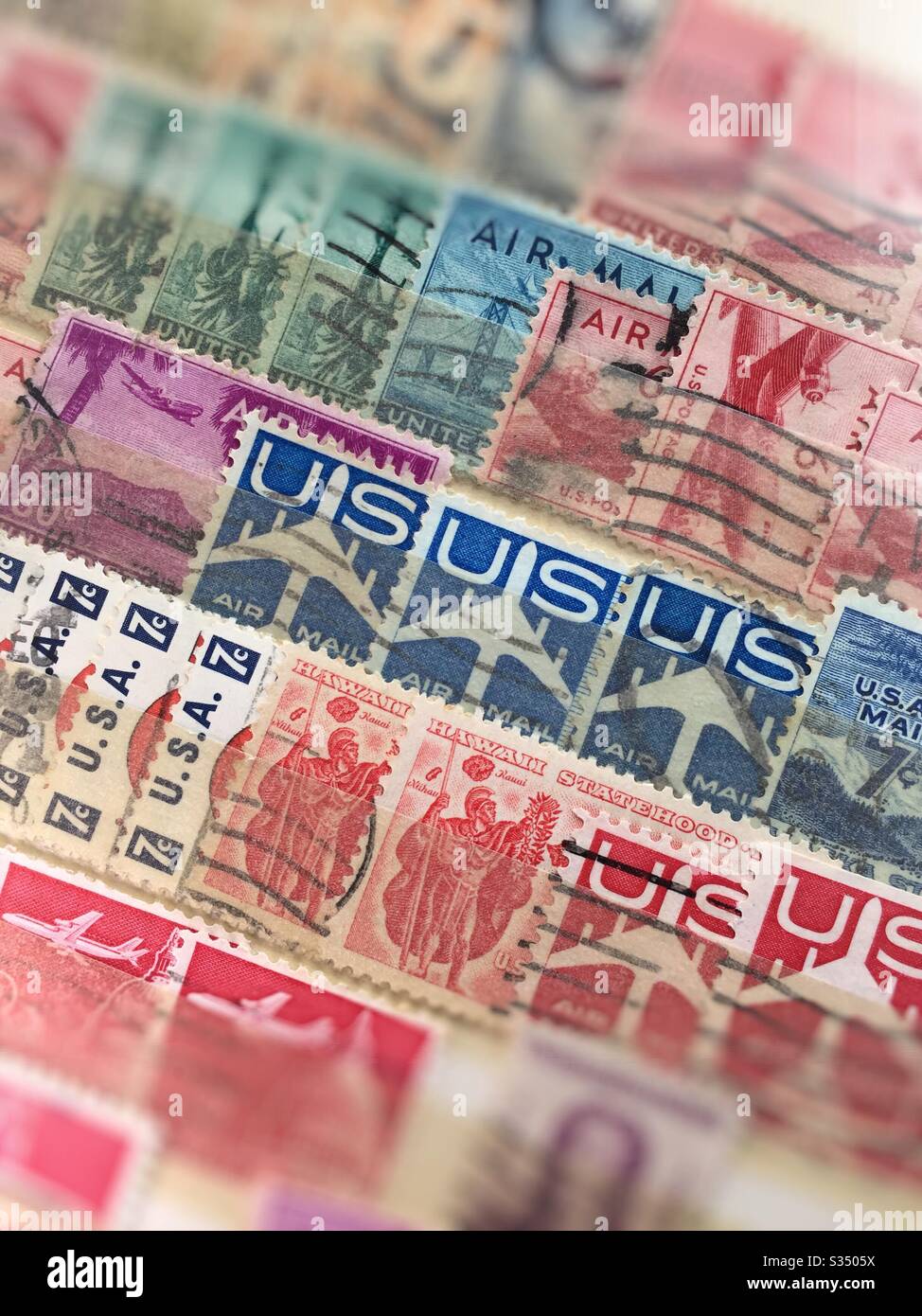 Vintage Air mail and commemorative stamps filed in a stamp collectors stock book, USA - Smartphone Captured Stock Image