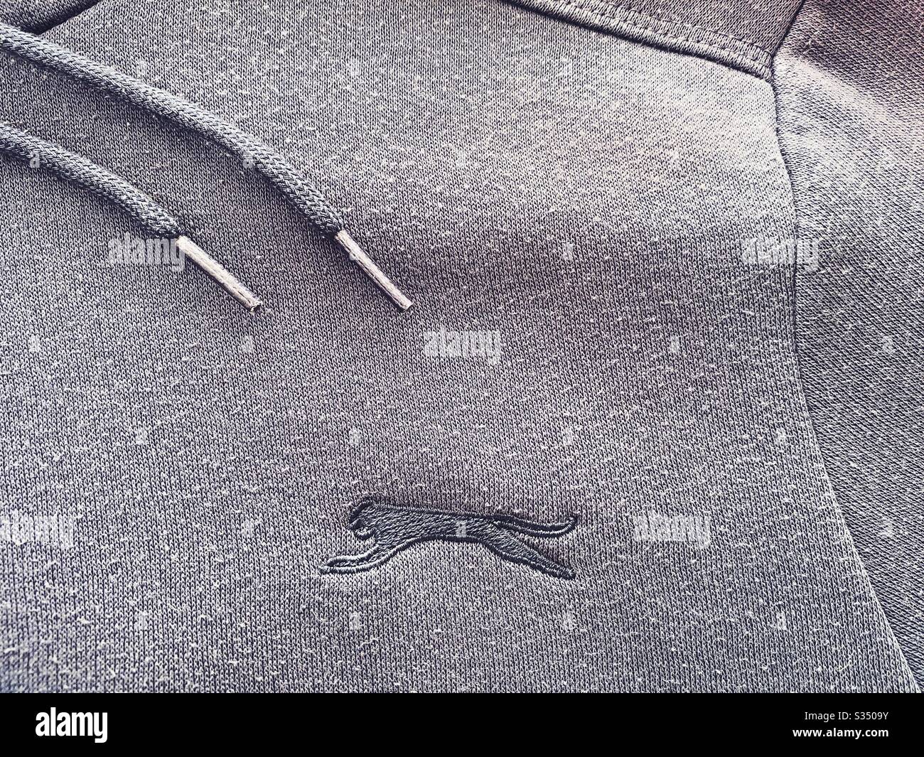Close up details of designer men’s clothes, menswear. Slazenger hooded jumper, hoodie, hoody. - Smartphone Captured Stock Image