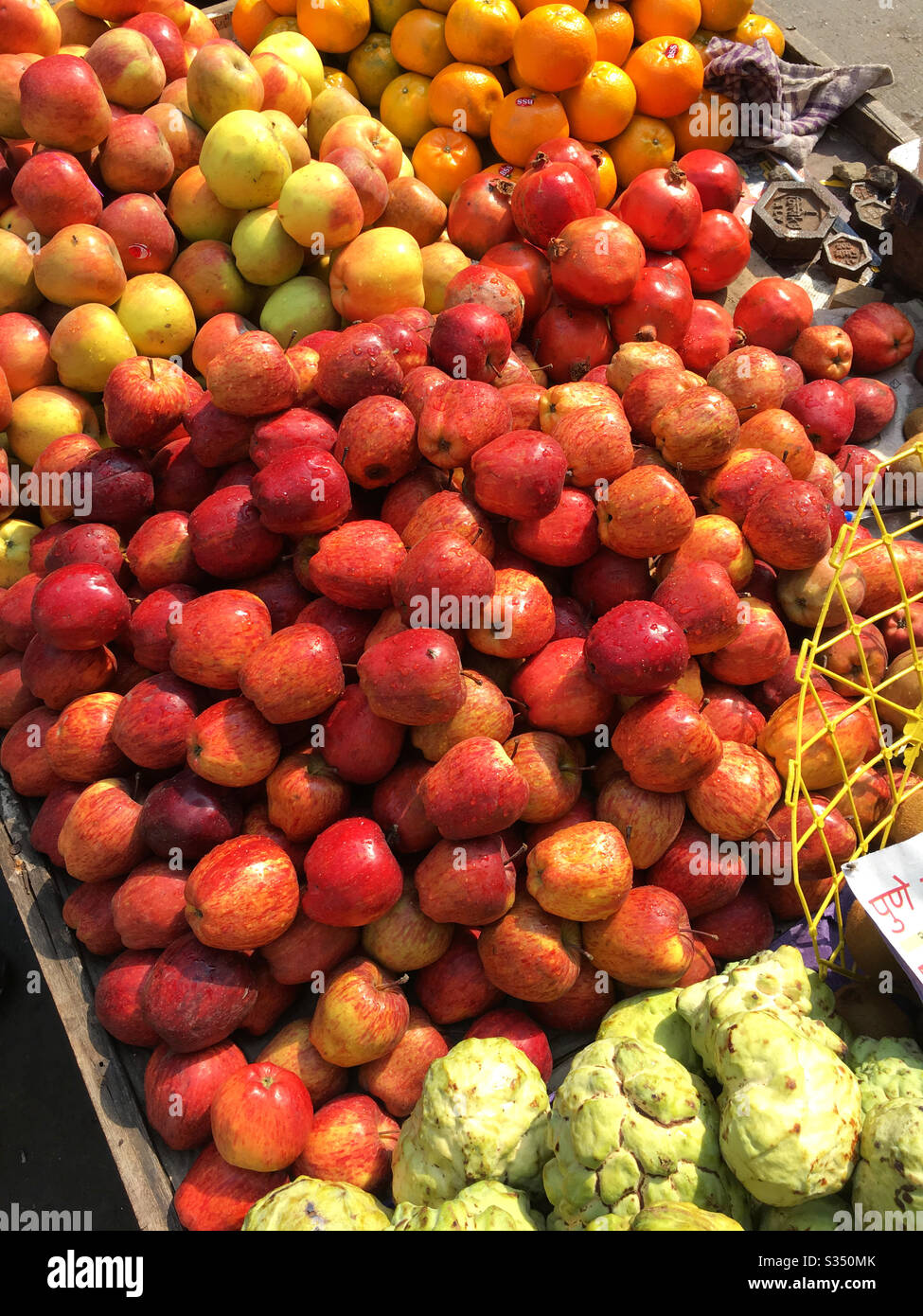 Apples and other fruits for sale on hand cart near Churchgate station
