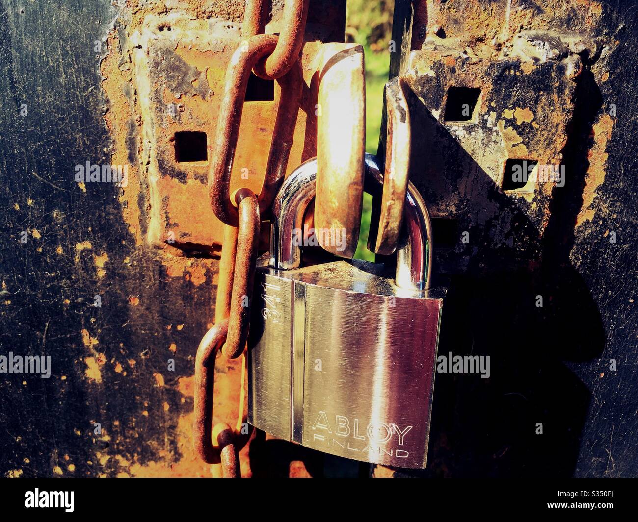 Coronavirus lockdown, padlock on gate - Smartphone Captured Stock Image