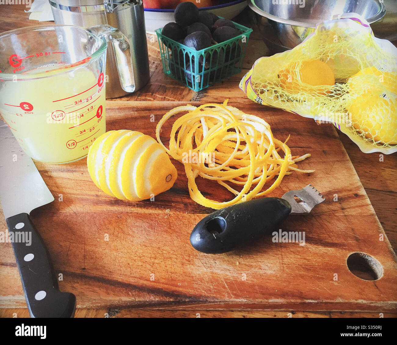 Lemon Zest Peel with Juice and Figs Stock Photo