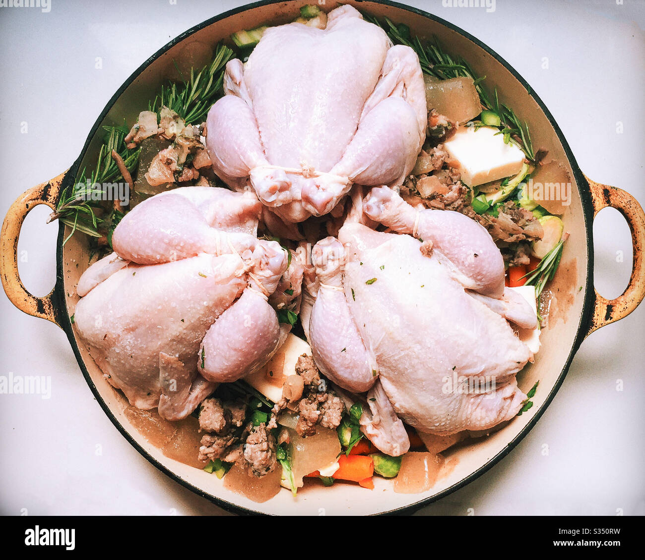 Cornish Hens, Raw and Prepared for Cooking Stock Photo
