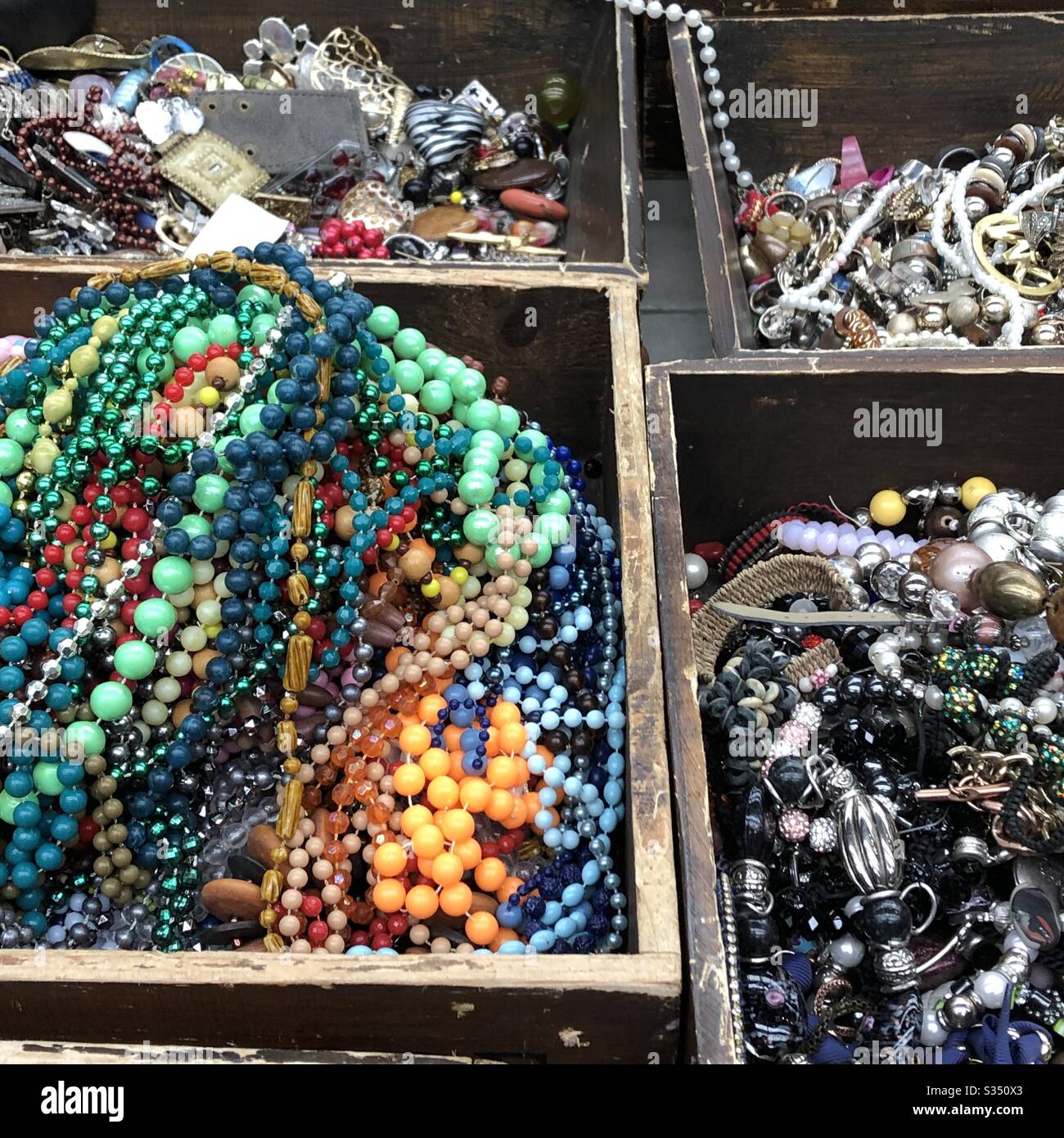 Vintage costume jewelry jumble for sale at street market Bologna Italy Stock Photo