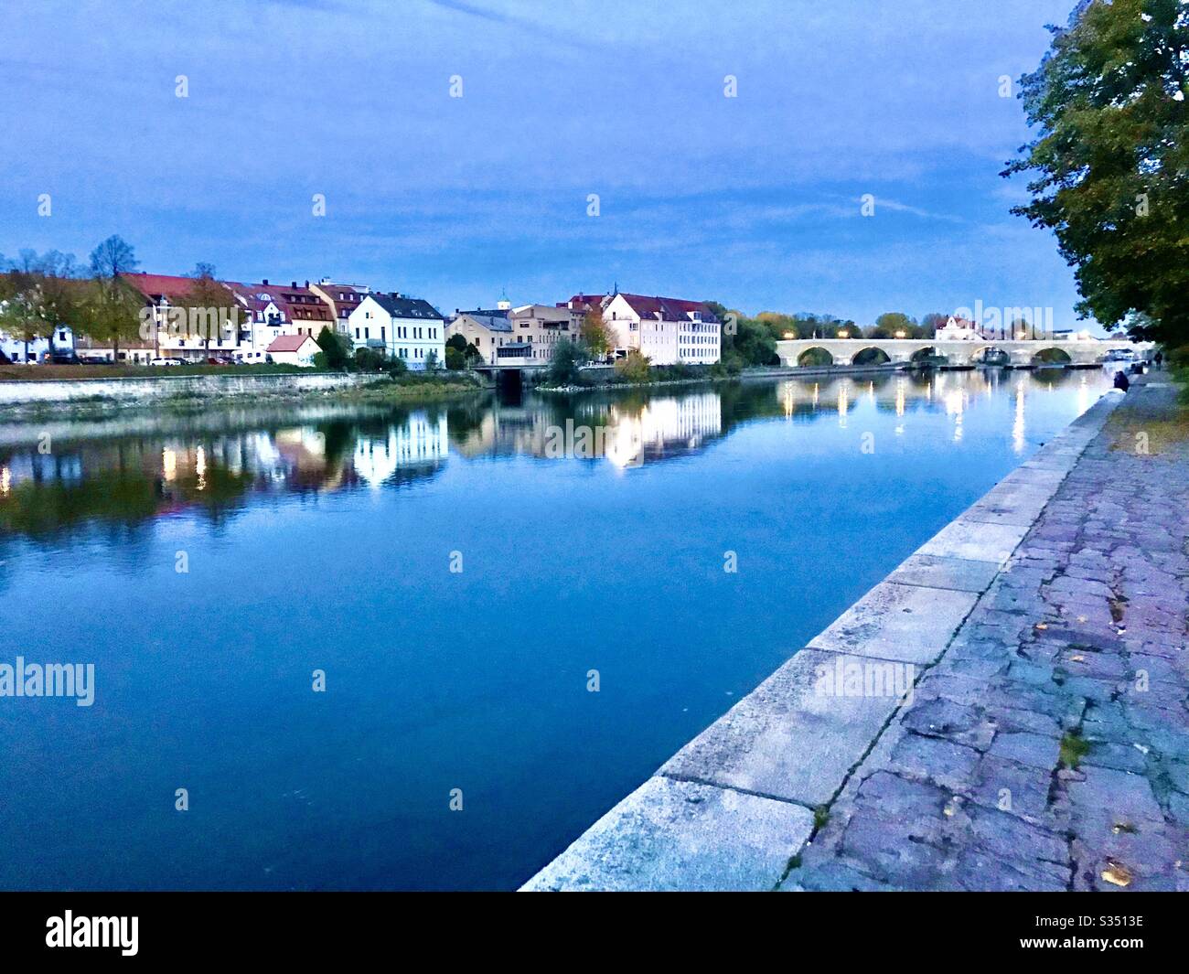 Regensburg Germany and Danube River at dusk Stock Photo