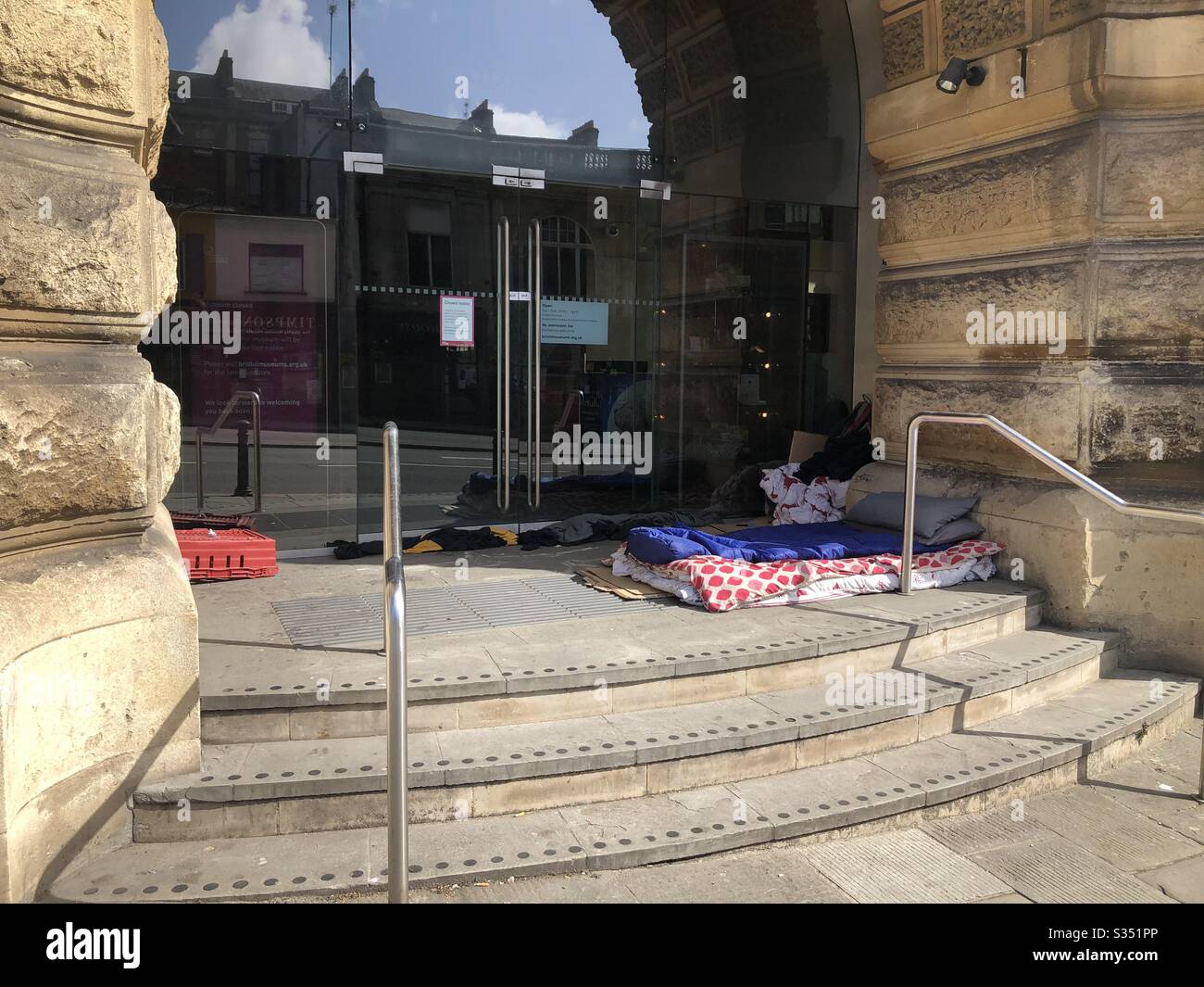 Sleeping bags and other items on the steps of Bristol City Museum during the coronavirus lockdown in the UK Stock Photo