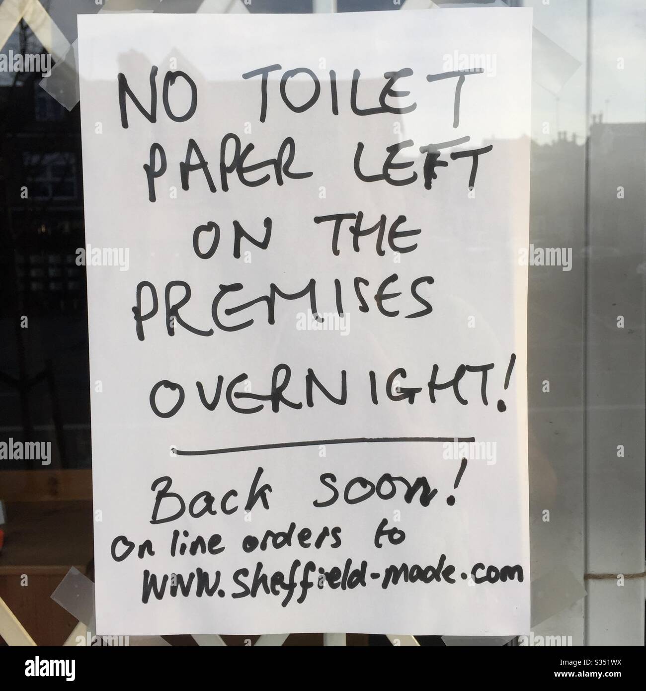 No Toilet Paper Left on the Premises Overnight sign - Smartphone Captured Stock Image