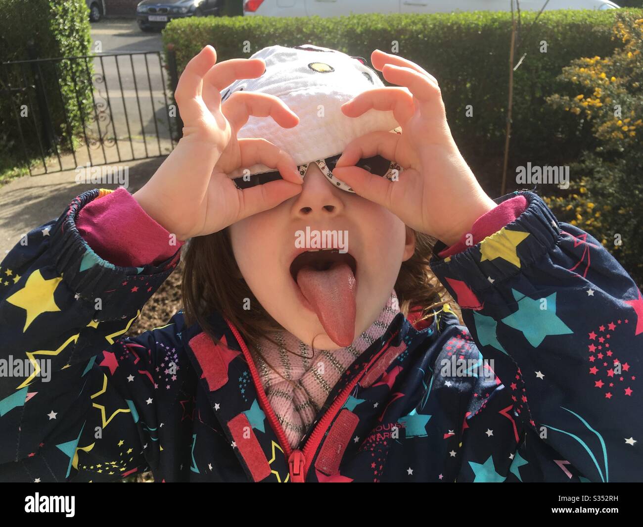 Young girl pulling a funny face Stock Photo Alamy