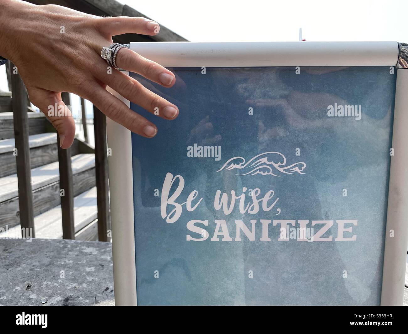 Sign reminding people to sanitize your hands Stock Photo
